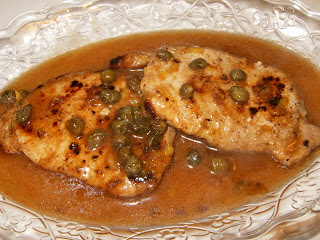 scaloppine al limone tarjoilulautasella